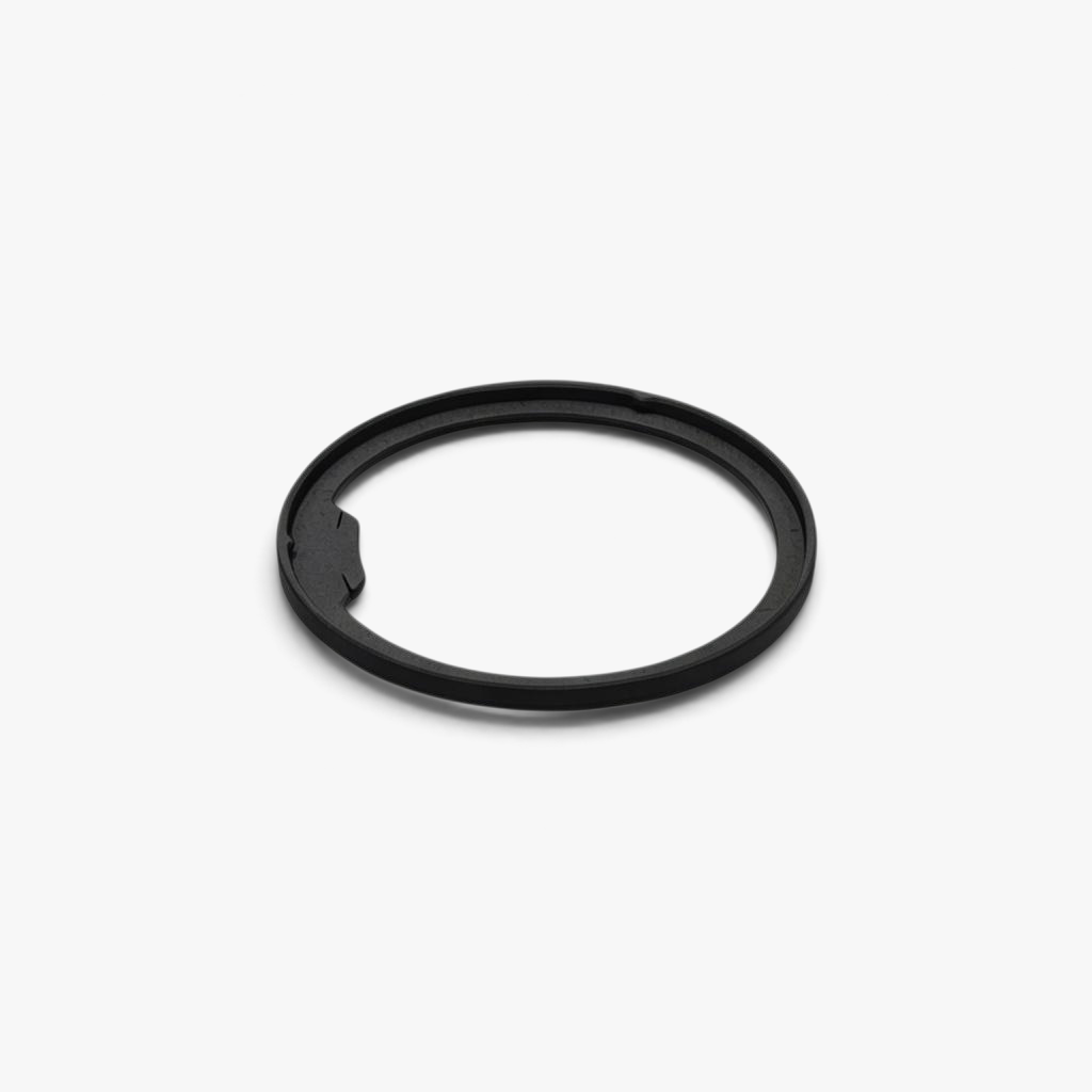 FŪTL Spool Savers black plastic ring for reinforcing industrial thread spools with an integrated tangle tab