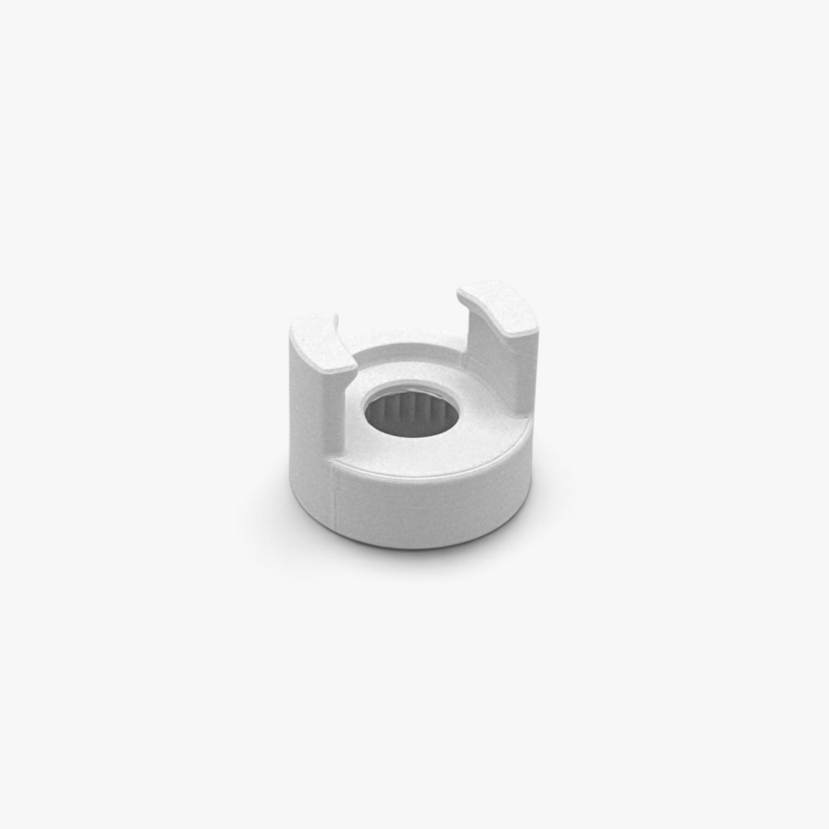White FŪTL Bobbin Top accessory designed to hold a bobbin on top of industrial sewing thread spool.